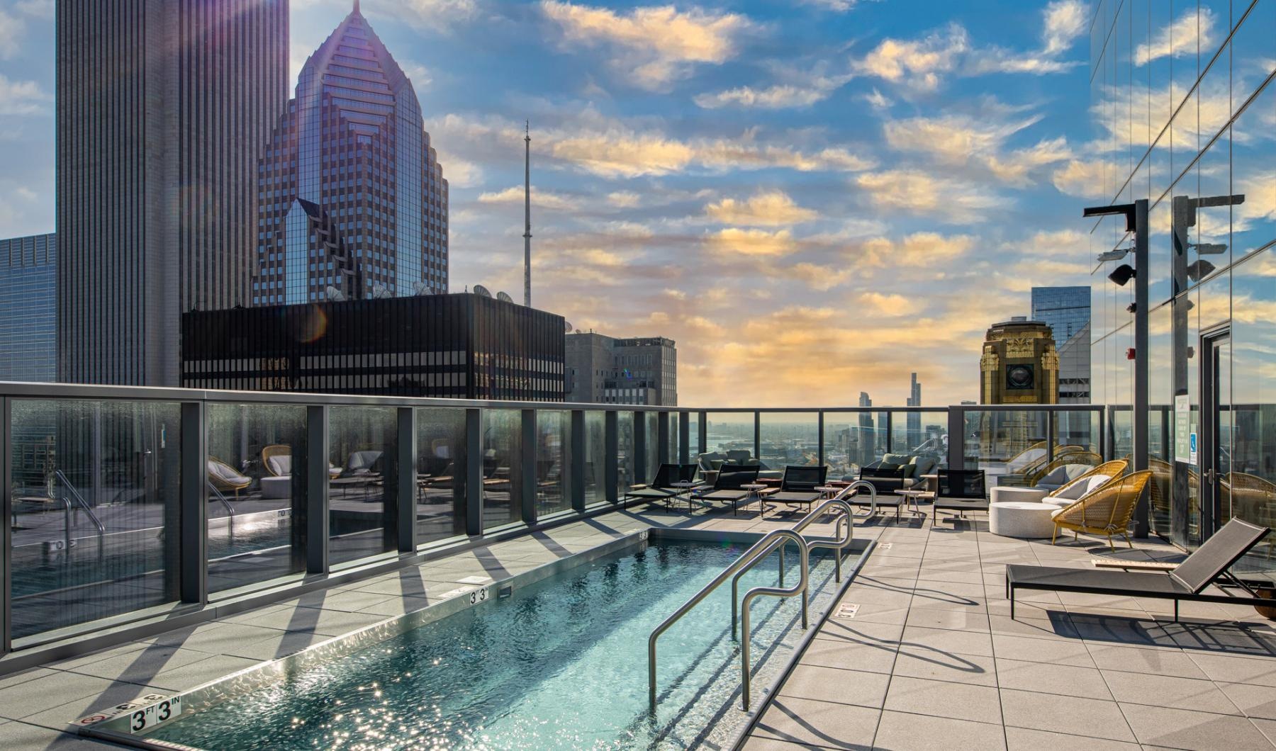 a pool with a city in the background