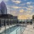 swimming pool with city views and lounge chairs