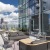 terrace with seating areas and plants with a view of the city