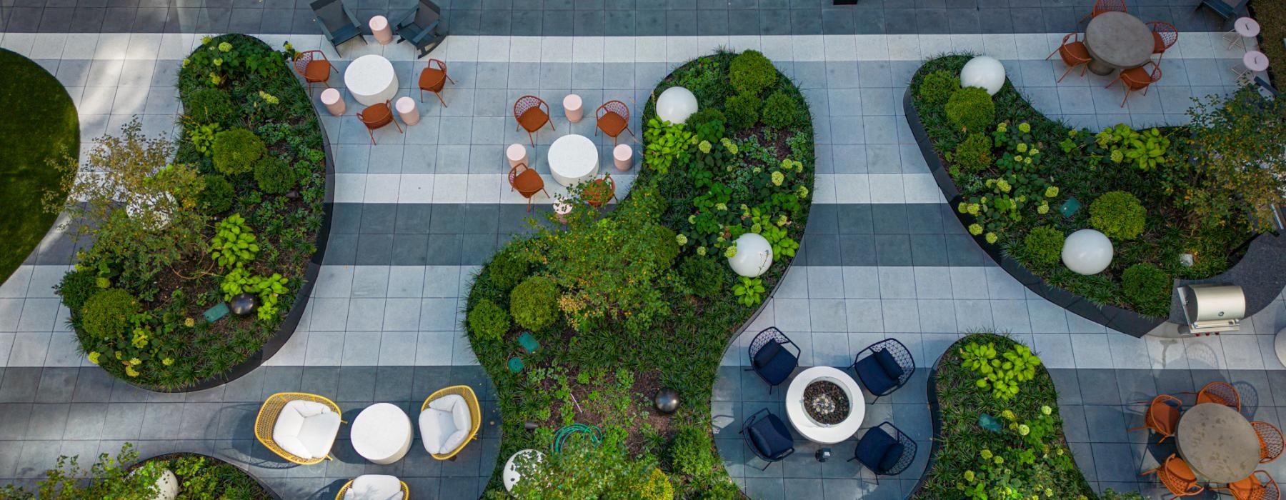 a high angle view of a patio with chairs and tables