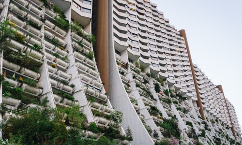 modern luxury apartment building with landscaping - what is a resort style apartment